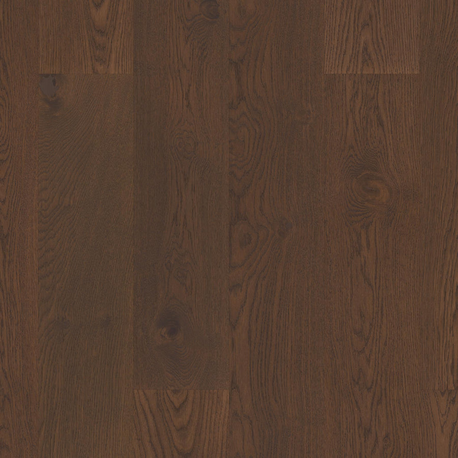 Manchester 7 1/2" White Oak Hardwood features visible grain patterns and natural knots, complemented by a smooth, polished finish for a timeless look.