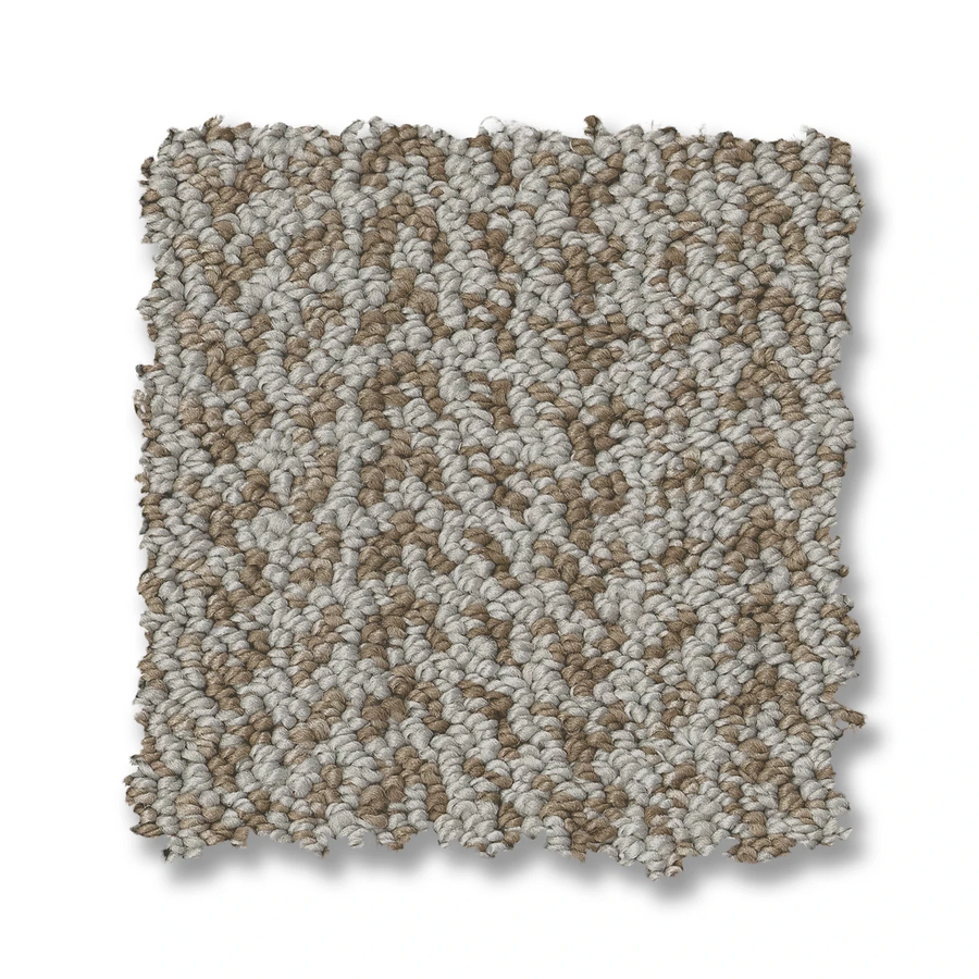 The Marquet On Trend Carpet is a rectangular swatch with a looped texture and a blend of light beige and tan fibers on a white background, highlighting the appeal of contemporary carpet design.