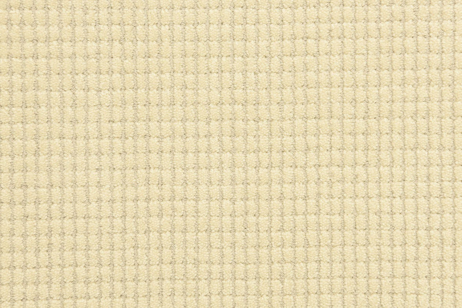 Close-up of Bungalow Pet Friendly Carpet in beige, featuring a soft, textured fabric with an evenly colored, repeating square sculptured pattern ideal for carpet or upholstery.