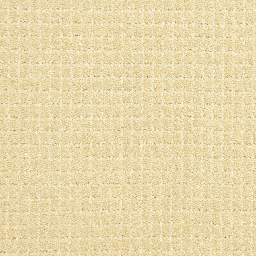 Close-up of the Bungalow Pet Friendly Carpet in beige, showcasing its subtle square pattern and soft woven texture—ideal for adding elegance and durability to any space.