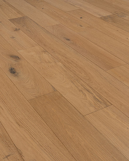 Riverside European Oak 7" Hardwood floorboards feature a light brown finish with visible grain and knots, arranged in a staggered pattern for timeless riverside charm.