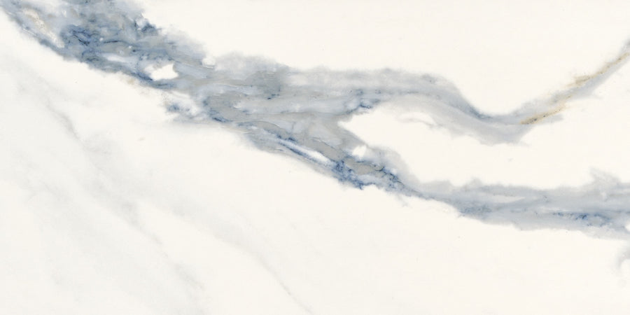 The Milan 12x24 Polished Porcelain Tile features a white marble look with subtle gray and blue diagonal veins, capturing an elegant, natural pattern in durable porcelain.