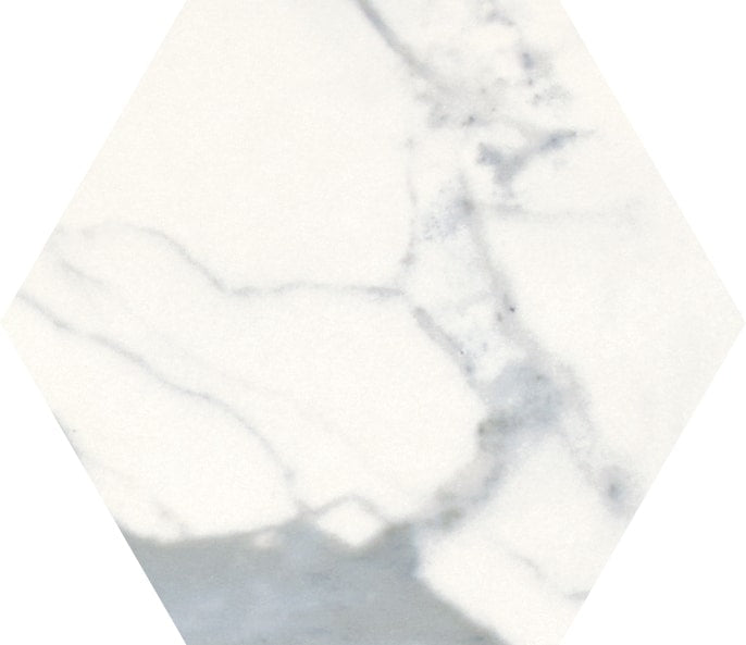 The Milan 6" Hexagon Matte Porcelain Tile features a hexagonal shape, white marble look with light gray veining and subtle shadows, delivering a natural and elegant stone appearance.