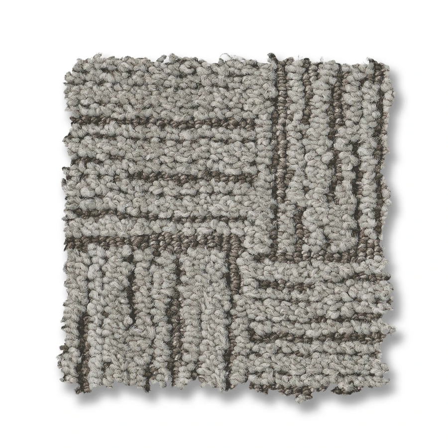 Moderne On Trend Carpet: A square swatch in neutral tones, featuring a looped pile with a geometric basket weave pattern of intersecting lines on a white background.
