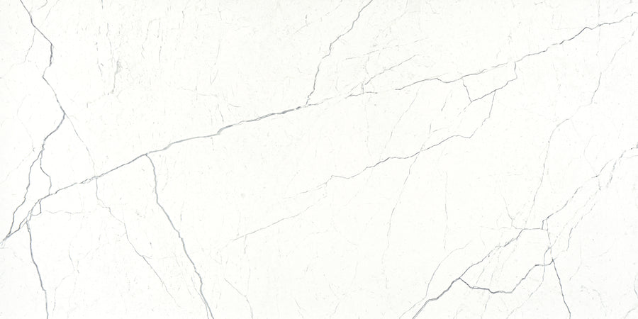 The Monaco 12x24 Porcelain Tile features a white marble-look surface with thin, irregular gray veins and a smooth, polished finish—ideal for bringing elegant luxury to any space.
