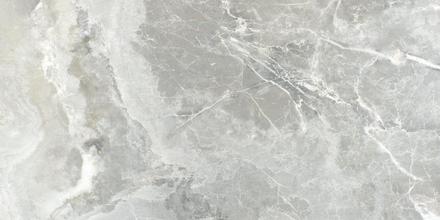 Monaco 12x24 Porcelain Tile offers a light gray marble look with subtle white and darker gray veining, smooth texture, and natural stone patterns for a luxurious finish.