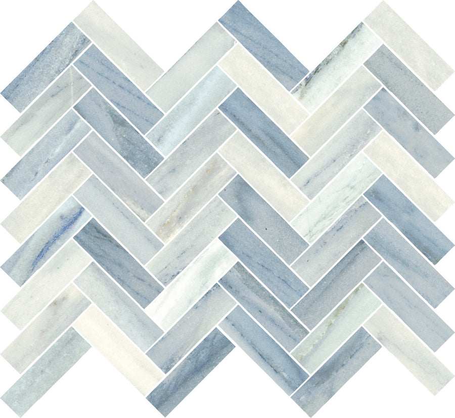 The Monte Carlo 1x3 Herringbone Mosaic Matte Porcelain Tile features a smooth, marbled texture in blue, gray, and white shades, forming an elegant zigzag pattern perfect for enhancing any home's flooring.