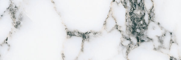 The Monte Carlo 4x12 Porcelain Tile features a white marble-look surface with unique gray and black veining, bringing elegant, timeless style and luxury to any space.