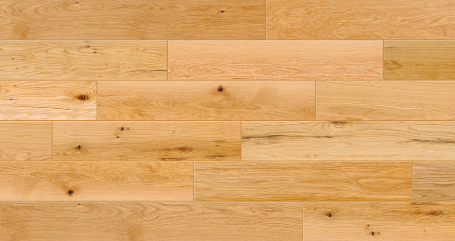 Valor Hall 7 1/2" White Oak Hardwood features light-colored engineered planks with natural European oak grain and occasional knots. Its smooth matte finish adds rustic elegance and warmth to any space.