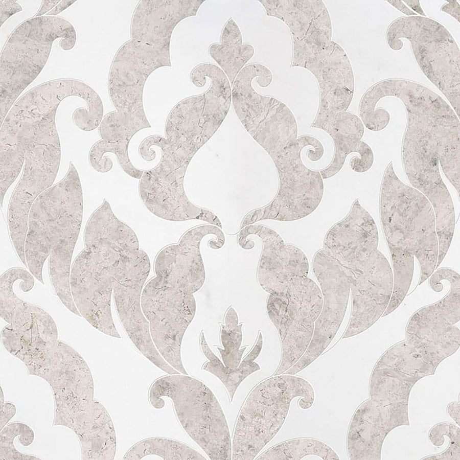 The Talya Rumi 13 9/16 x 18 Waterjet Natural Stone features an ornate light gray and white damask pattern—an elegant choice for master baths that pairs beautifully with marble or stone accents.