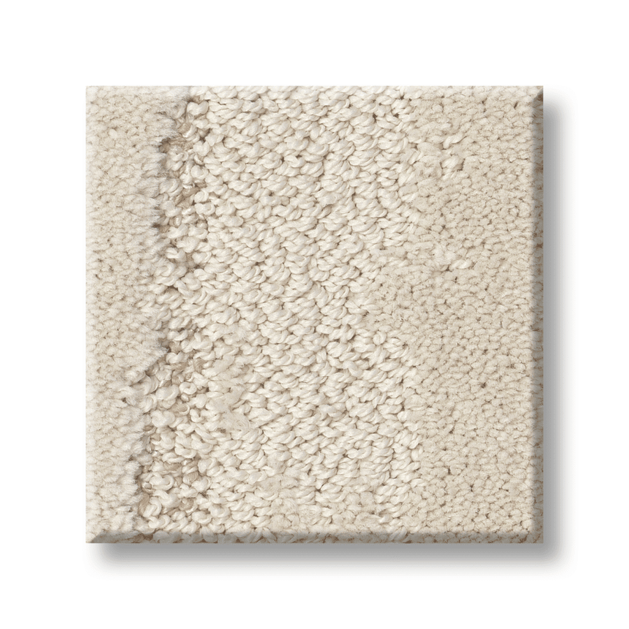 A square sample of Tranquil Spirit Pet Friendly Carpet in light beige, with a matte base and subtle looped fibers in a gentle sweeping brushstroke pattern, is displayed against a white background.