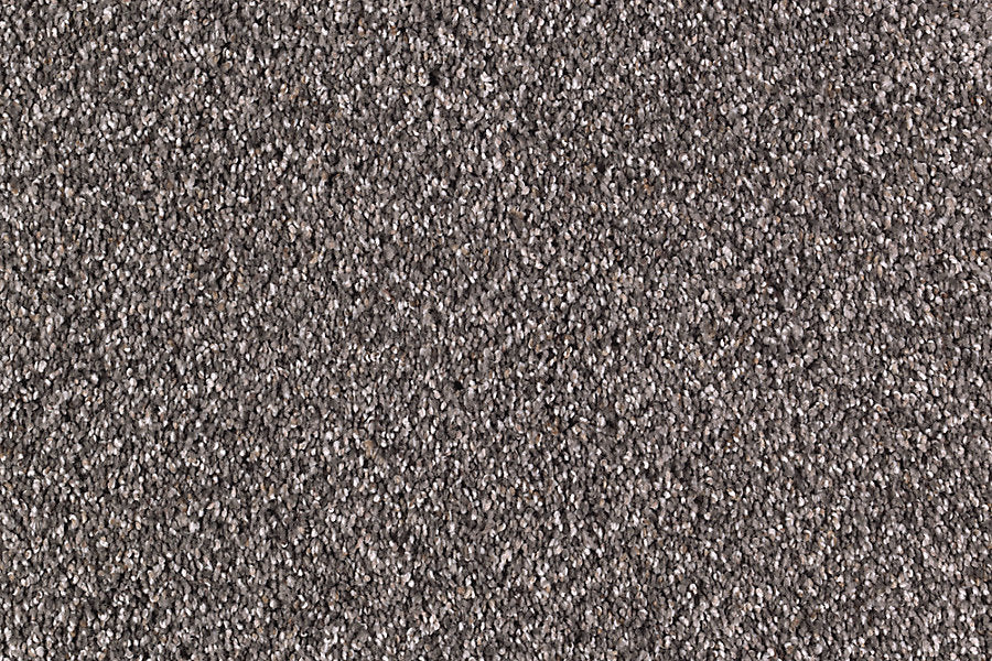 Close-up view of Nature's Majesty Family Friendly Carpet, featuring tightly woven, textured brown fibers and a subtle flecked design for a dense, uniform surface pattern.