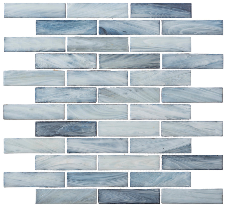 The New England Brick Glass Tile features rectangular blue and white marbled tiles arranged in a brick pattern, creating a decorative handmade mosaic ideal for kitchen backsplashes or bathroom showers.