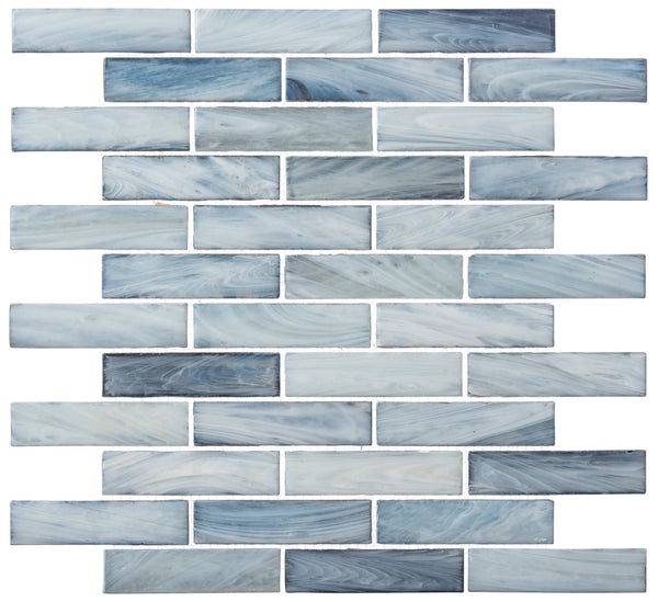 The New England Brick Glass Tile features rectangular blue and white marbled tiles arranged in a brick pattern, creating a decorative handmade mosaic ideal for kitchen backsplashes or bathroom showers.
