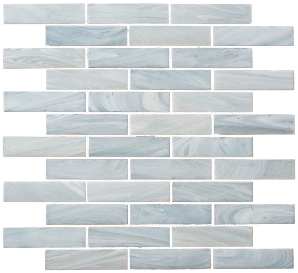 New England Brick Glass Tile features a glossy, marbled light blue and white finish in a staggered brick layout with white grout—ideal for bathroom showers or kitchen backsplashes.