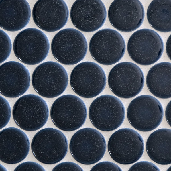 New Form Penny Round Mosaic Tile features glossy, dark blue round pieces on a light gray background—ideal for modern backsplashes or chic shower walls.