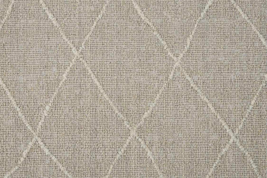Close-up of the Old World Trellis On Trend Wool Carpet in beige, featuring a textured loop pile and a subtle, irregular diamond pattern in a lighter shade for a soft, modern geometric look.