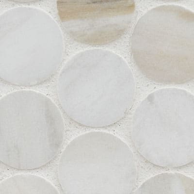 Close-up of Olympia Sandalwood Penny Round Marble Mosaic showcases large, round, light gray and white marble tiles with subtle veining on a white grout background—perfect as a backsplash tile.
