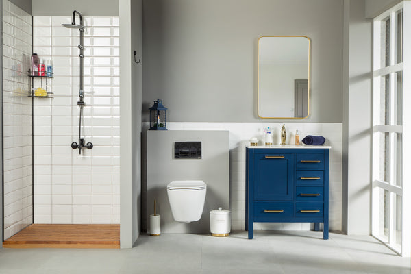 Modern bathroom with a walk-in shower on the left, wall-mounted toilet in the center, and an Ashley 30