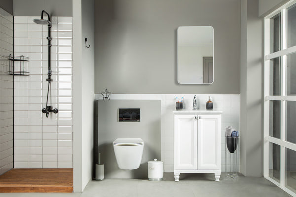 Modern bathroom with a walk-in shower, wall-mounted toilet, and the Isabel 24