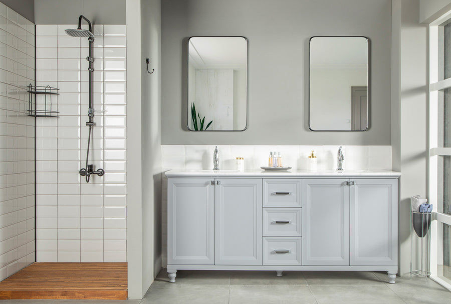 Modern bathroom with a walk-in shower featuring white subway tiles, a wooden floor, and the Isabel 72" Vanity with solid wood drawers, double sinks, and two rectangular mirrors above the countertop.
