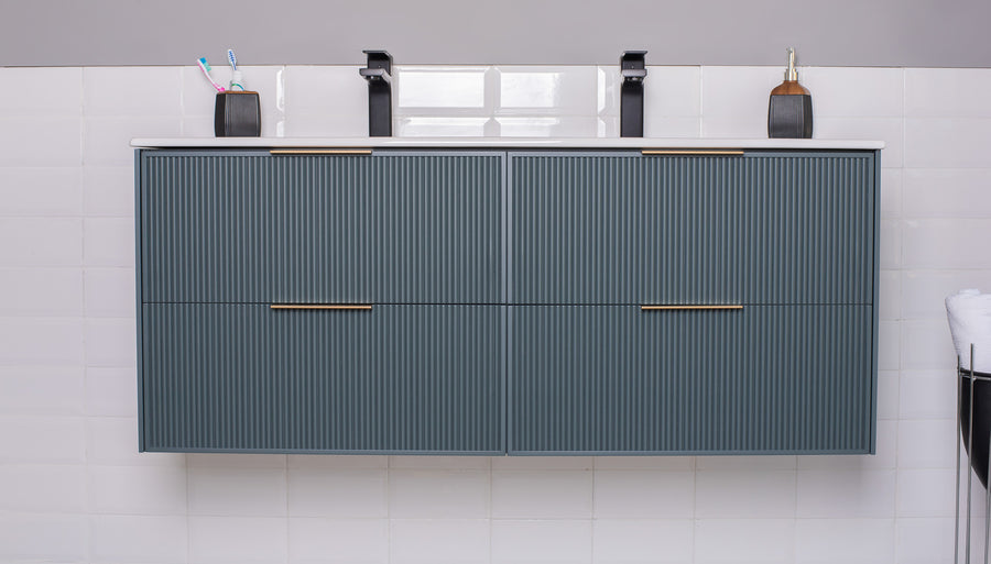 The Sorrento 48" Vanity features two blue-gray cabinets, sleek black faucets, toothbrush holders, and a soap dispenser set against a white tiled wall—a modern, stylish centerpiece for your bathroom.