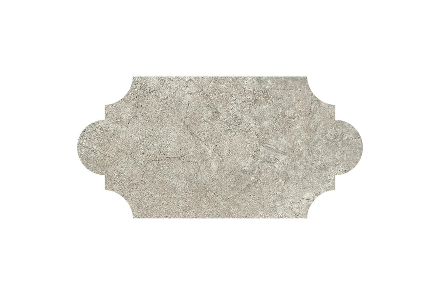 The Santorini 12x24 Provenzale Porcelain Tile features a textured light gray stone-effect surface, scalloped edges on the left and right sides, and is set against a crisp white background for a decorative touch.