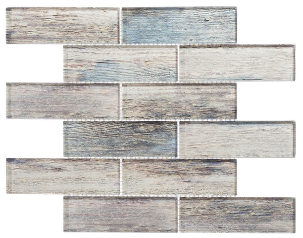 The Westminster Glass Mosaic features rectangular tiles in an offset pattern with a weathered wood look in gray, beige, and blue—ideal for rustic backsplashes or vintage-inspired shower walls.