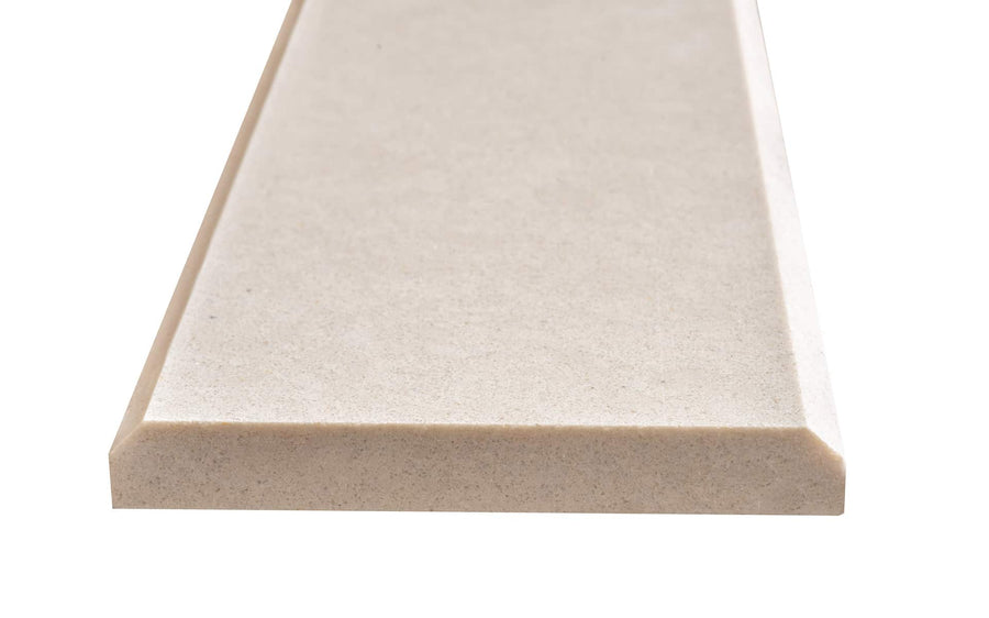 A close-up of the Double Bevel 4x36 Threshold, a rectangular beige natural stone slab with beveled edges, perfect for floor transitions or use as marble thresholds, shown isolated on a white background.