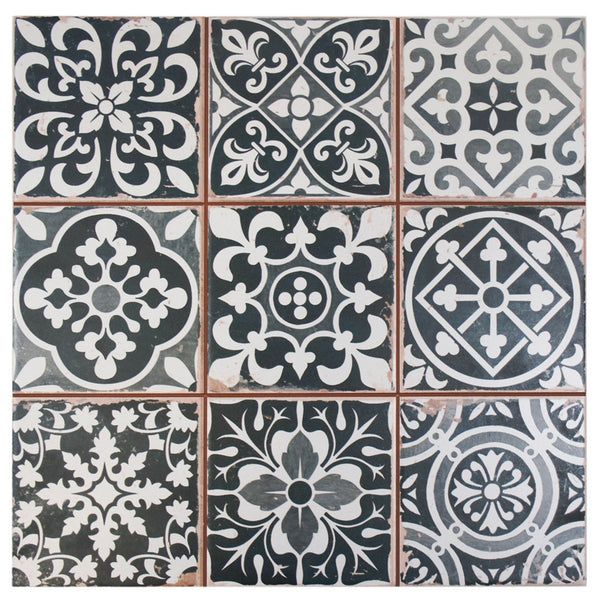 The Faenza 13x13 Patterned Tile features nine ceramic tiles in a 3x3 grid with black and white floral and geometric encaustic-inspired designs, separated by slim reddish-brown grout for a bold accent on floors or walls.