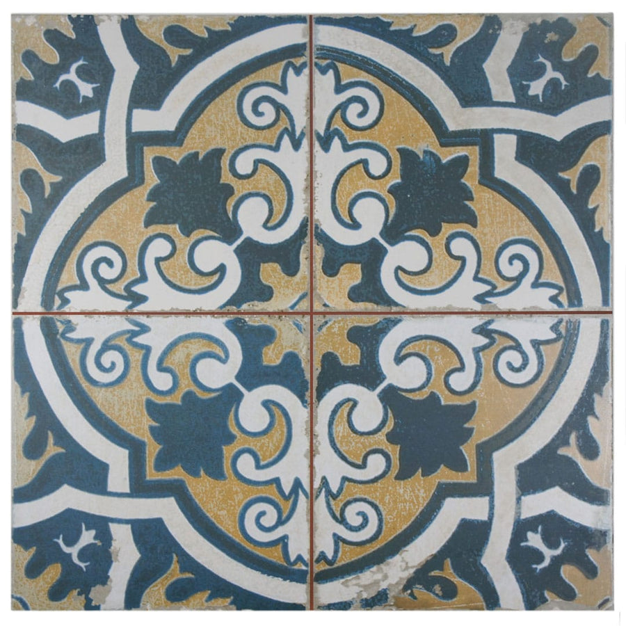Four Kings Canarsie 17 3/4 x17 3/4 patterned tiles arranged together feature ornate geometric and floral designs in dark blue, white, and mustard yellow with a distressed, vintage industrial look for floors or walls.