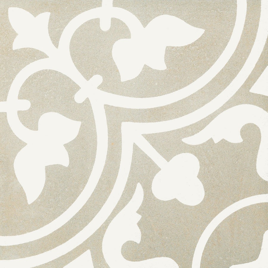 Reverie #11 8x8 Patterned Tile offers a beige base with an intricate white floral and leafy design. This rectified porcelain tile delivers a vintage-inspired, decorative look with precise edges for a classic finish.