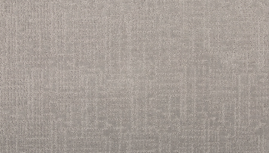 Close-up of Delicate Features Family Friendly Carpet in light gray, showcasing a soft, textured geometric pattern. This eco-friendly carpet is ideal for home or office flooring, offering both comfort and style.