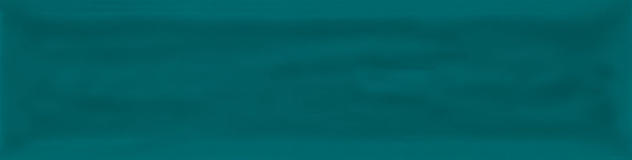 The Watercolor 3x12 Subway Tile is a rectangular, glossy teal tile with smooth, rounded edges—ideal for modern updates or bringing a vibrant color palette to any space.