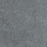 A close-up of Platform 2x8 Porcelain Tile reveals a textured gray surface with a metallic look and rough, grainy appearance.