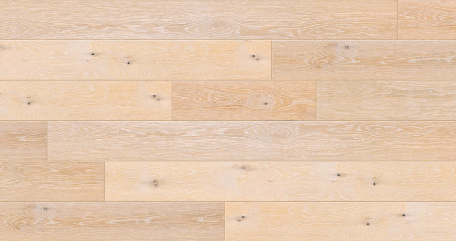 Valor Hall 7 1/2" White Oak Hardwood flooring features light European oak planks with natural wood grain and knots, arranged in a staggered pattern for rustic elegance.