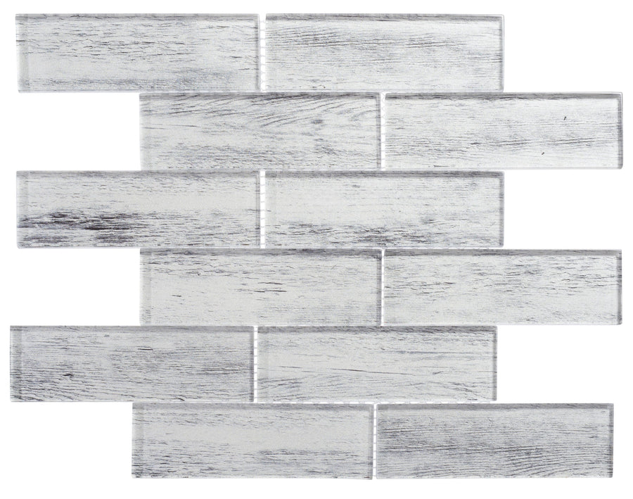 The Westminster Glass Mosaic features rectangular tiles in a staggered brick pattern with a white and gray wood grain texture, creating a weathered, rustic look—ideal as a stylish backsplash against a plain white background.