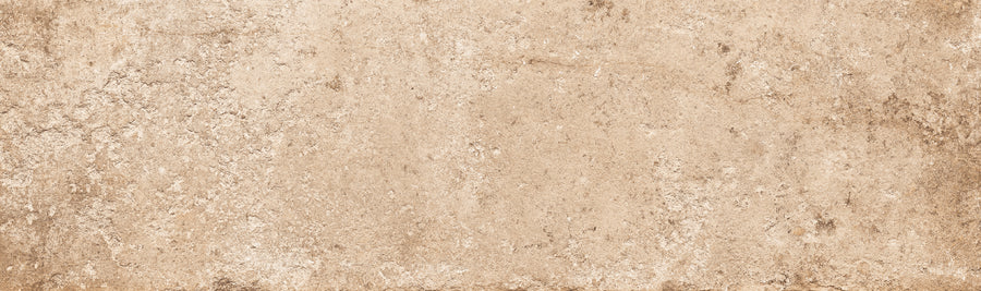 Empire 2x10 Brick Porcelain Tile features a textured beige surface with subtle color variations and roughness, offering the weathered stone look of aged parchment or rustic tile.