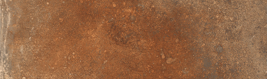 The Empire 2x10 Brick Porcelain Tile features an uneven texture, with reddish-brown and orange tones and patchy detailing that mimics the look of weathered stone.