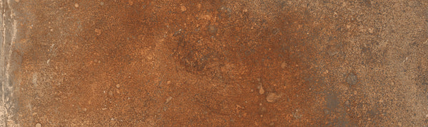The Empire 2x10 Brick Porcelain Tile features an uneven texture, with reddish-brown and orange tones and patchy detailing that mimics the look of weathered stone.