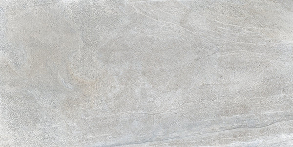 The Santorini 12x24 Porcelain Tile features a light gray stone-effect surface with subtle swirls and fine lines, offering a neutral, minimalist look reminiscent of natural concrete or marble with elegant texture.