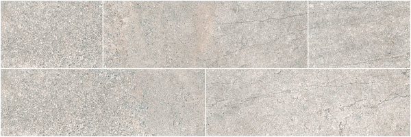 Five Santorini 4x12 Porcelain Tiles in light gray, with a stone look and subtle veining, are arranged in two rows. Their textured, neutral finish evokes natural elegance and the tactile beauty of real stone surfaces.