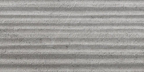 A close-up of the Santorini 12x24 Grooves Deco Porcelain Tile shows its textured gray, stone-effect surface with horizontal ridges and grainy patterns.