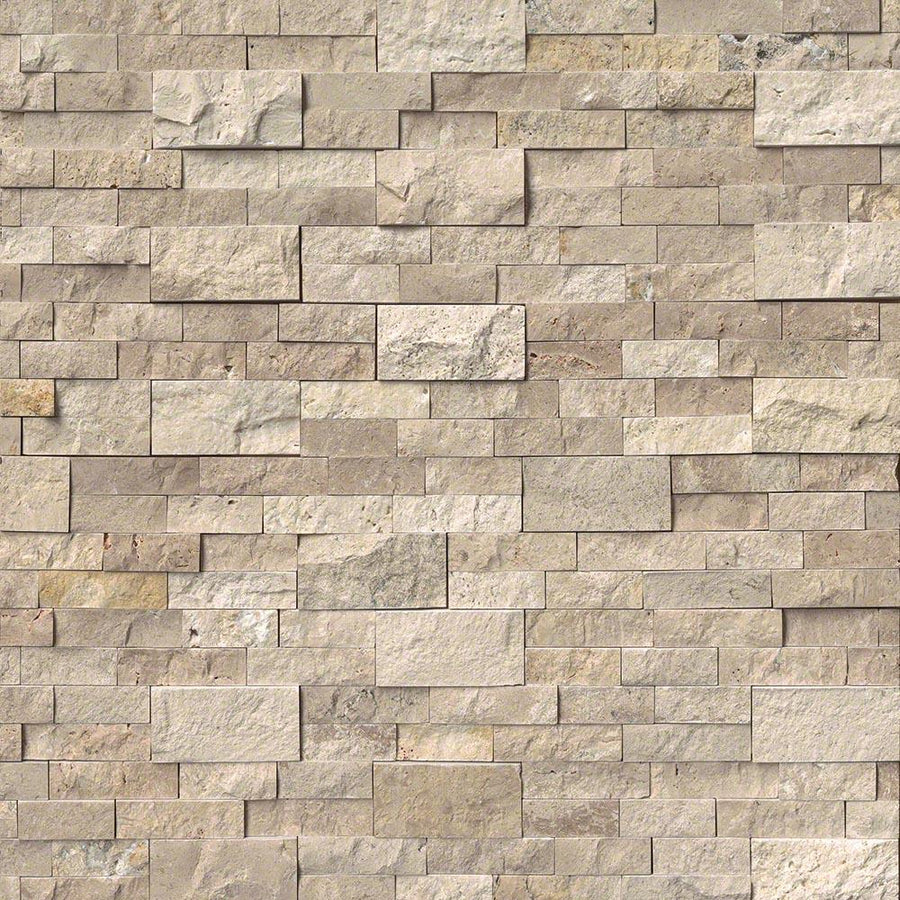 A wall featuring Landscape 6x24 Natural Stone Ledger Panel tiles in beige and light brown, arranged in a staggered pattern for a natural, rustic look. The varied tones and textures make it ideal for enhancing any space.