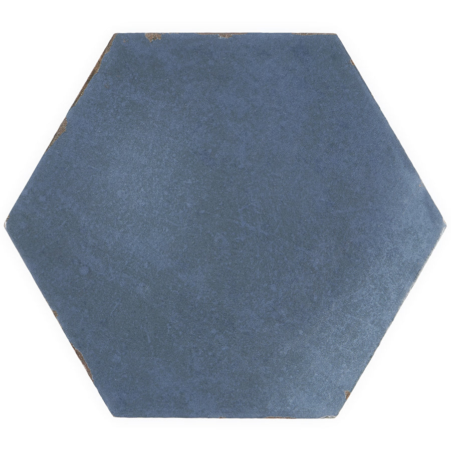 The CostaHex 6" Hexagon Porcelain Tile is shown in blue, featuring a vintage look with slightly worn edges and a matte finish against a white background.