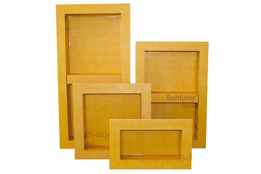 Four rectangular Schluter Shower Niches of varied sizes, each covered in yellow grid-patterned waterproofing, are standing upright and overlapping.