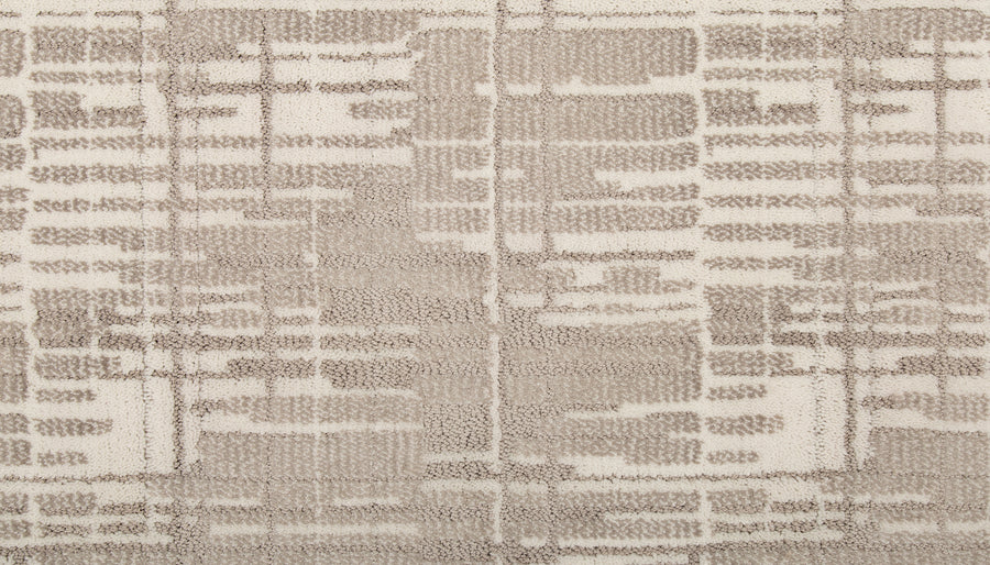 The Tartan Veil On Trend Carpet features a modern, abstract geometric pattern in beige and off-white with irregular lines forming block shapes. Its soft, plush texture adds an elegant touch to any space.