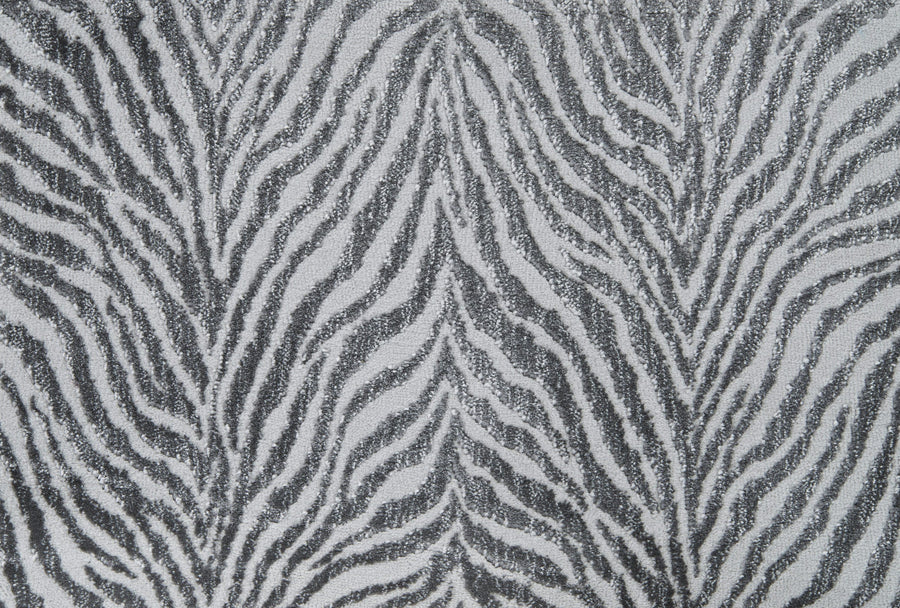 Close-up of the Boteti On Trend Carpet—a black and white zebra design with wavy, irregular lines that mimic natural markings, ideal for adding a bold accent to contemporary décor.