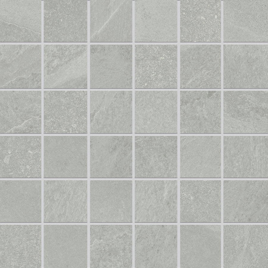 Shyft 2x2 Mosaic Porcelain Tile features a grid of light gray porcelain tiles with subtle tonal variations and thin white grout lines, creating a clean, sleek, and modern look similar to Brazilian slate.