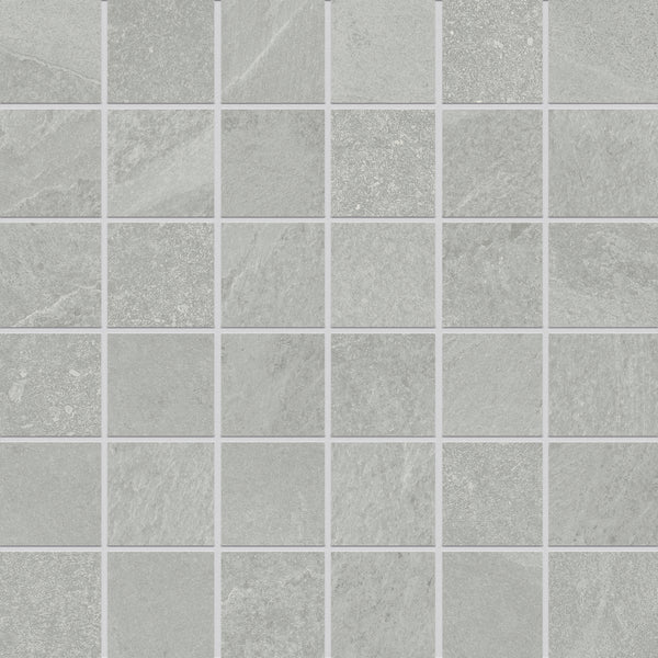 Shyft 2x2 Mosaic Porcelain Tile features a grid of light gray porcelain tiles with subtle tonal variations and thin white grout lines, creating a clean, sleek, and modern look similar to Brazilian slate.